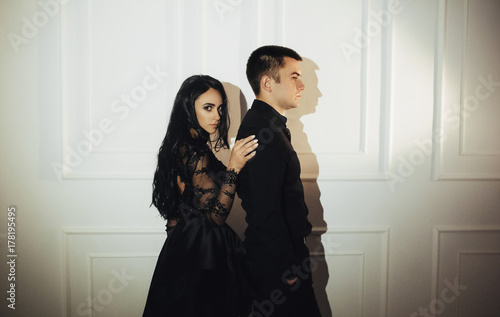 woman  with  theatrical mask and handsome man