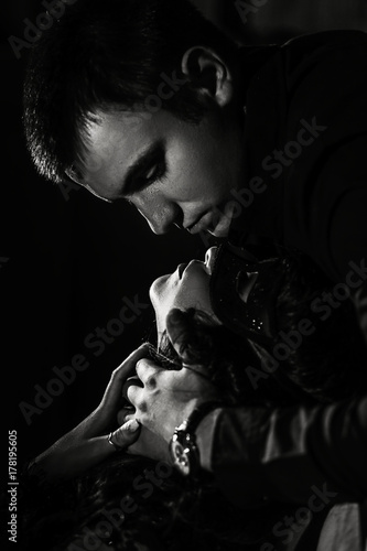 woman  with  theatrical mask and handsome man