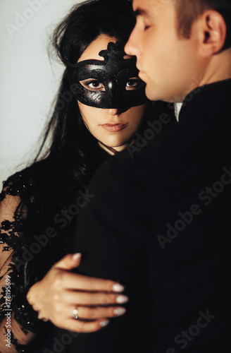 woman  with  theatrical mask and handsome man