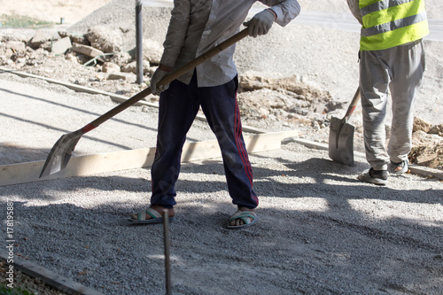 workers dub road sand and gravel