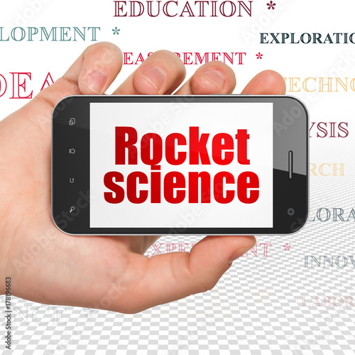 Science concept: Hand Holding Smartphone with red text Rocket Science on display, Tag Cloud background, 3D rendering