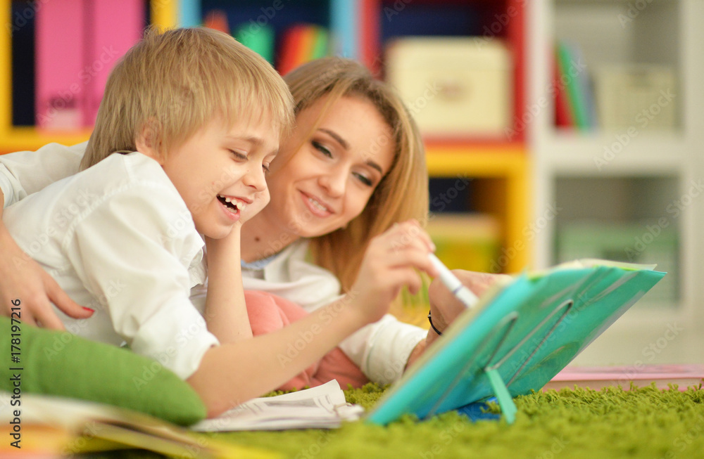 Mother with her son doing homework Mother with her son doing homework