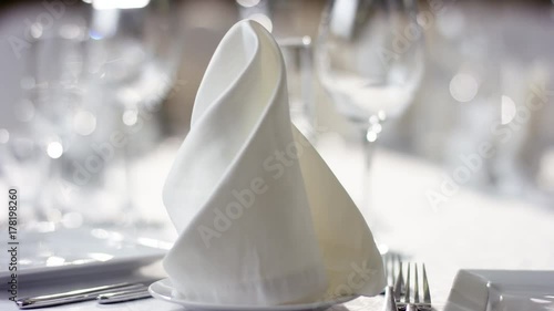 Shot of napkins on banquet table prepared for food serving at luxury Meliot restaurant