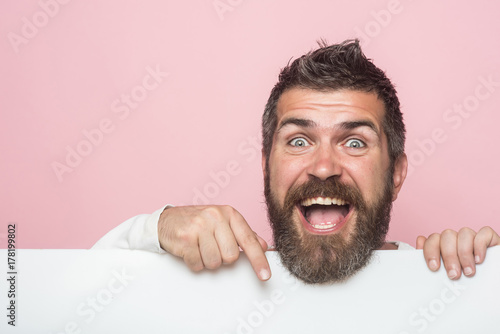 man with long beard on happy face with paper photo