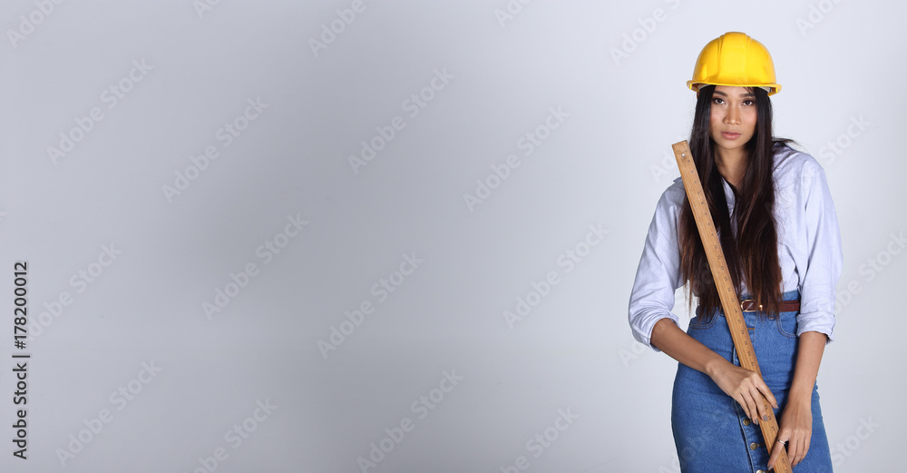Beautiful Asian Architect Engineer woman in yellow hard hat Beautiful Asian Architect Engineer woman in yellow hard hat