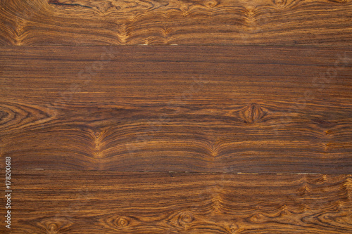 Dark wooden surface of the table