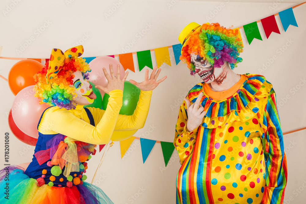 a terrible clown and a good clown. Halloween. The crazy clown and clowness. a terrible clown and a good clown. Halloween. The crazy clown and clowness.