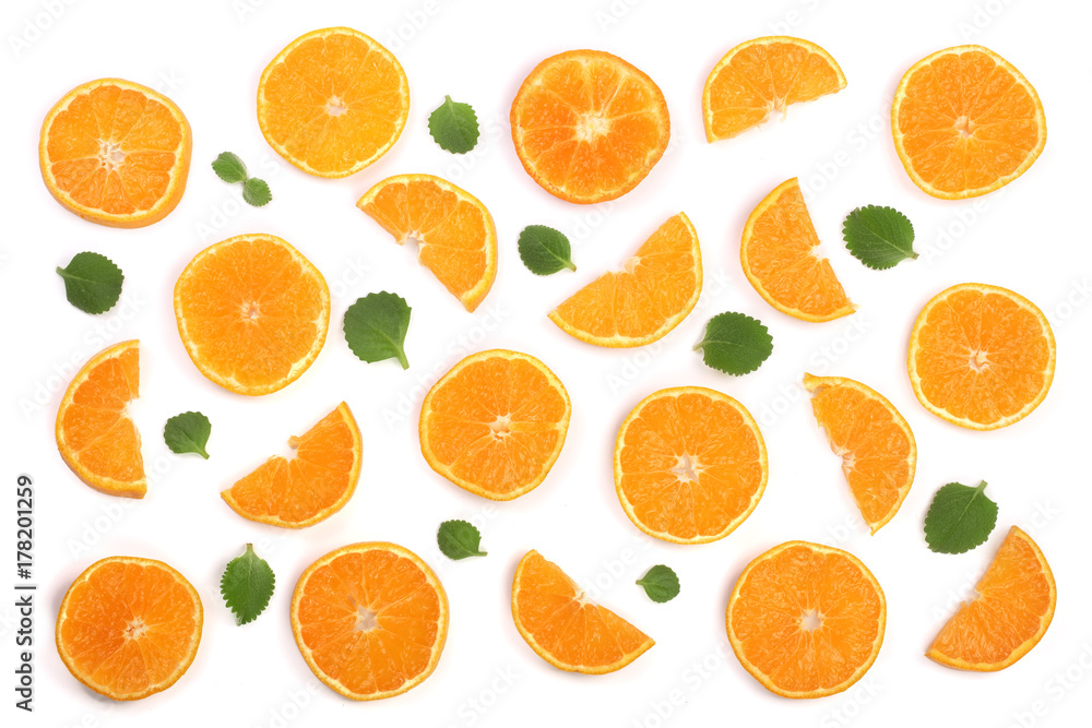 Slices of orange or tangerine with mint leaves isolated on white background. Flat lay, top view. Fruit composition Slices of orange or tangerine with mint leaves isolated on white background. Flat lay, top view. Fruit composition