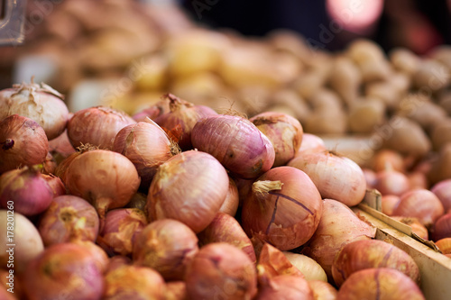 Organic onions on a market close up