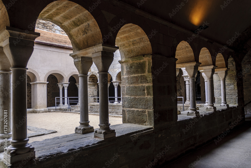 sight of the courtyard of the ruins of the Benedictine abbey of the Romanesque art close to the End of Creus in Gerona, Spain.