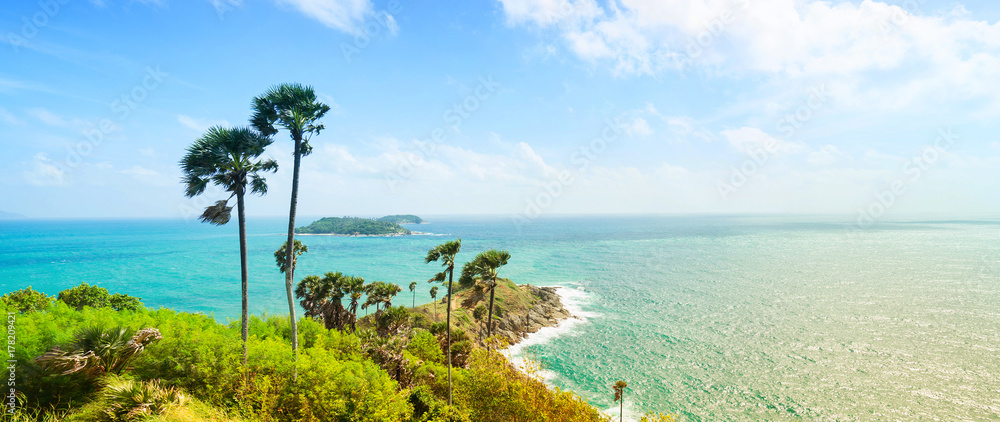 Obraz premium Phromthep Cape, beautiful Andaman sea view in Phuket island, Thailand. Blue sky and turquoise color sea. Banner