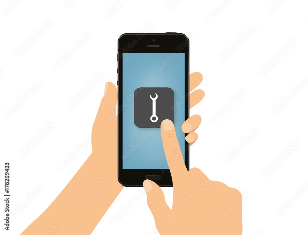 Hand tippt auf Smartphone - Schraubenschlüssel