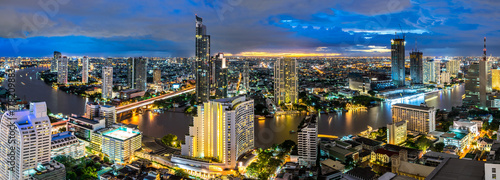 Bangkok city - Beautiful sunset curve Chao Phraya River panoramic Cityscape urban  of Bangkok city at night  , panorama landscape Thailand