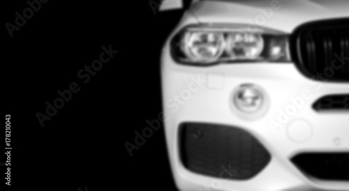 Blurred background with modern luxury white car . Car exterior details. Soft lightning