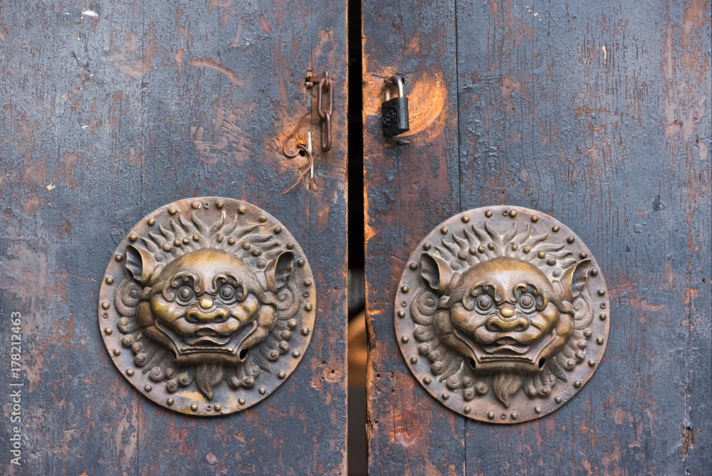 Old brown chinese traditional wooden gate with Lion door knockers, China Old brown chinese traditional wooden gate with Lion door knockers, China