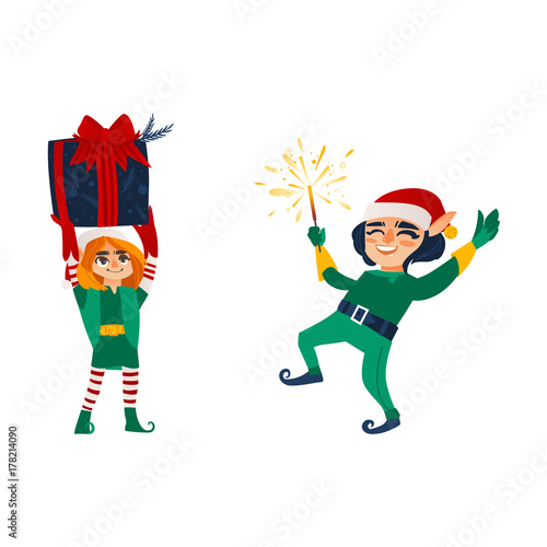 Two happy Christmas elves, Santa little helpers, holding present box, lighting a sparkler, flat cartoon vector illustration isolated on white background. Couple of happy Christmas elves, Santa helpers