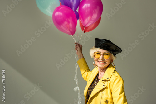 senior woman with balloons