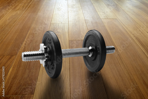 Dumbbells on Hardwood floor in renovated house