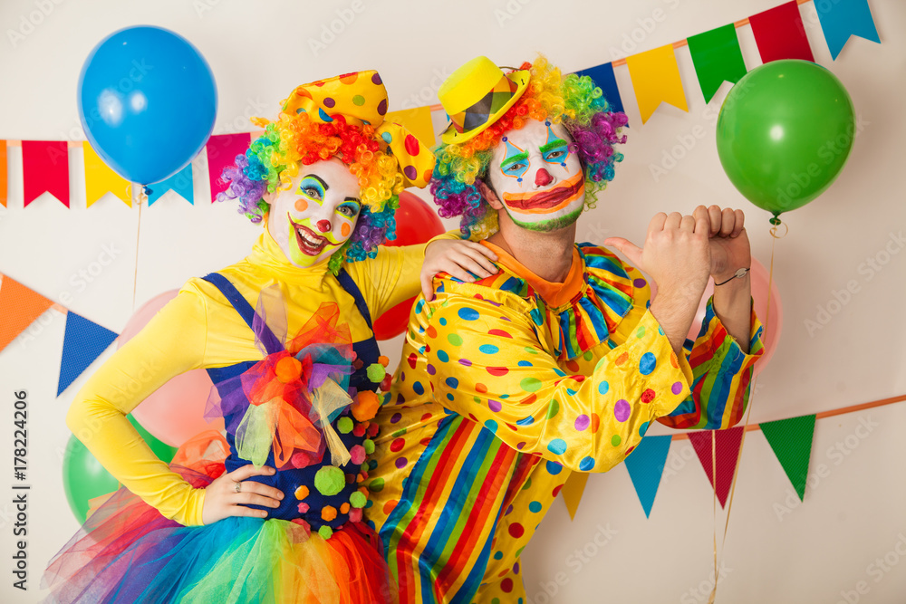 Two cheerful clowns. Birthday for children. Bright clown and clowness. Two cheerful clowns. Birthday for children. Bright clown and clowness.