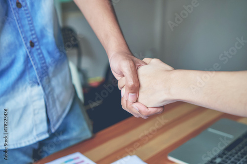 Joint Hands of Two Businessmen After Negotiating a Successful Business Agreement, And the handshake together. This is to promote cooperation in the joint business. Teamwork planning