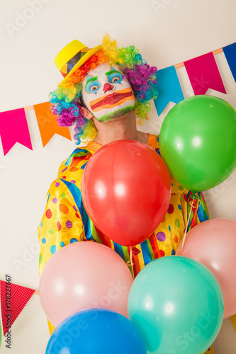 Bright cheerful clown. Birthday for children. Human emotions