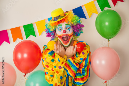 Bright cheerful clown. Birthday for children. Human emotions © izida1991