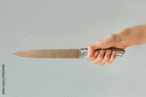 woman holding knife in hand photo