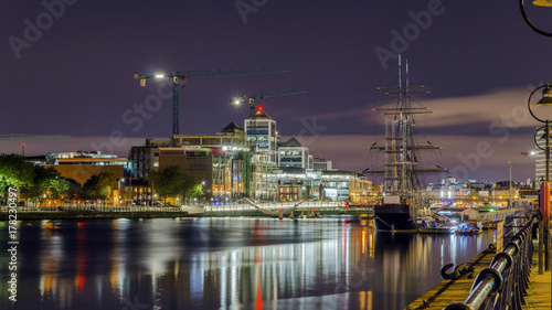 Dublin, Republic of Ireland, night view of The Custom House, Tall Ships, Sean O'Casey Bridge over the River Liffey