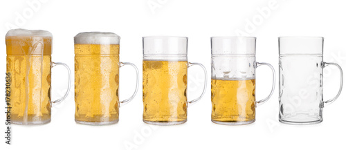 Five Glass Mugs with Beer Sorted From Full to Empty