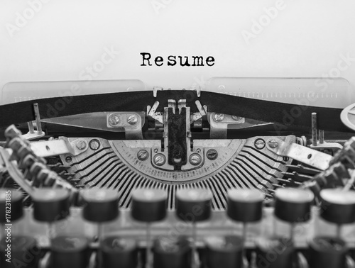 Resume written on an old typewriter concept for job search and recruitment
