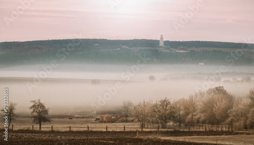 Nebellandschaft und Glockenturm Buchenwald photo