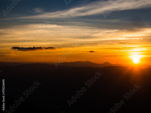 The colorful sky with the sunset and mountainn is such a beautiful nature, Thailand.