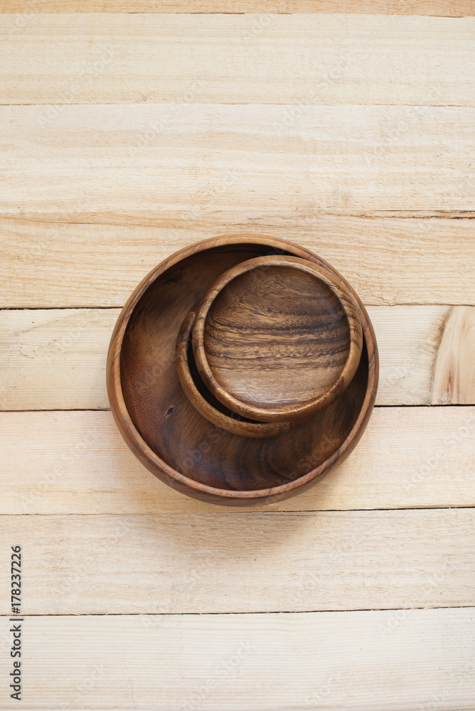 Emphty dishes. Wood bowls on a wooden background Emphty dishes. Wood bowls on a wooden background
