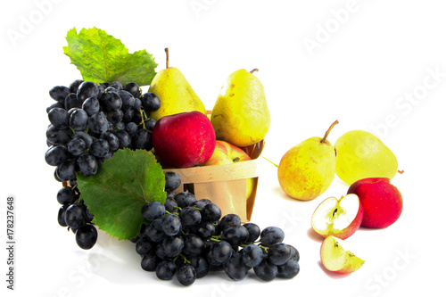 Fototapeta Naklejka Na Ścianę i Meble -  autumnal fruit in basket isolated on white background
