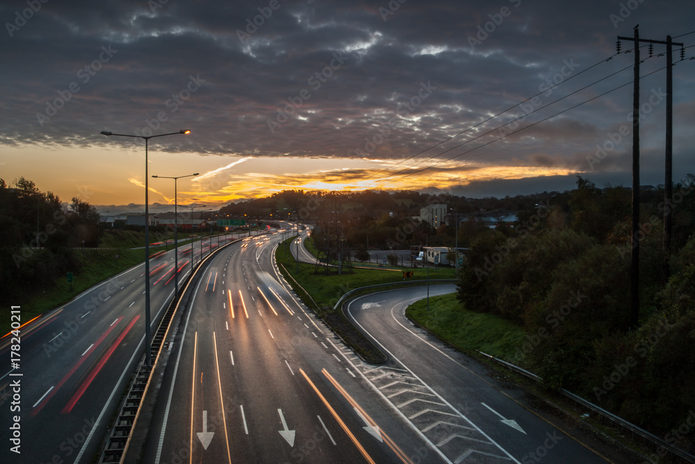 Morning sunrise on rush hour traffic, N40 motorway in Cork city, Ireland