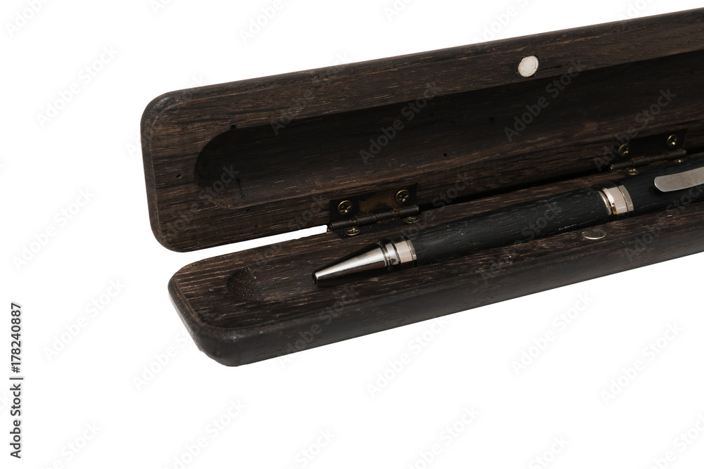 A pencil case for a ballpoint pen made from old oak on a white background A pencil case for a ballpoint pen made from old oak on a white background