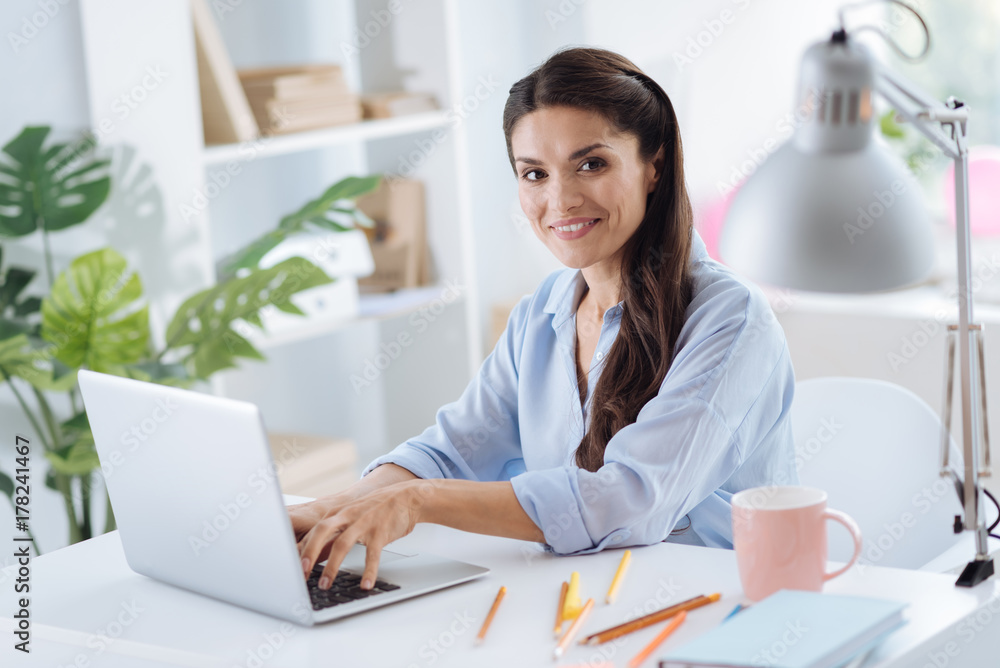 Delighted attractive woman looking at you Delighted attractive woman looking at you