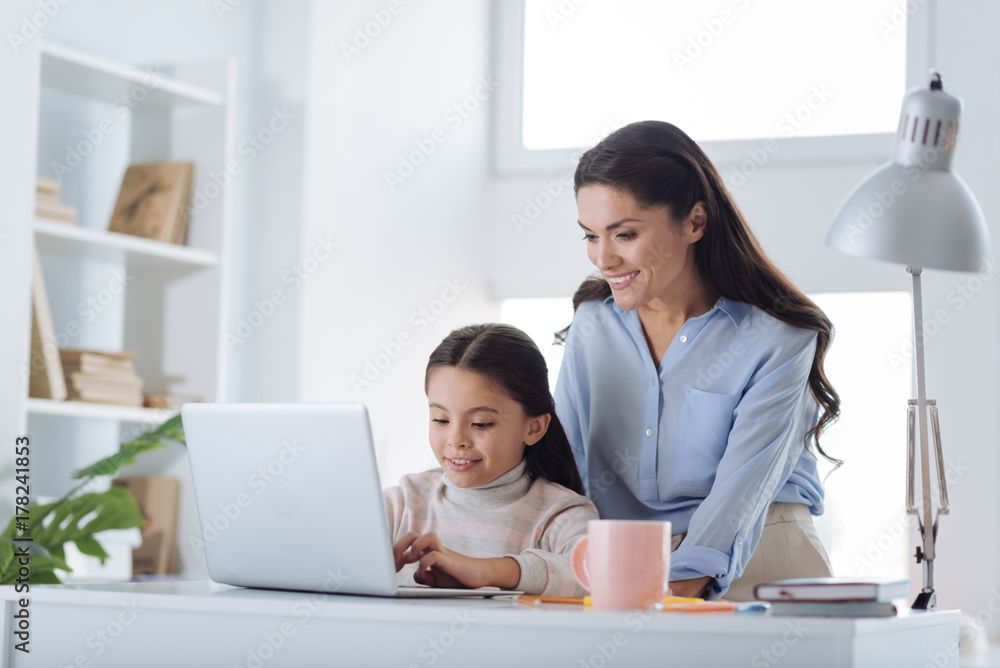 Delighted nice girl working on the laptop Delighted nice girl working on the laptop