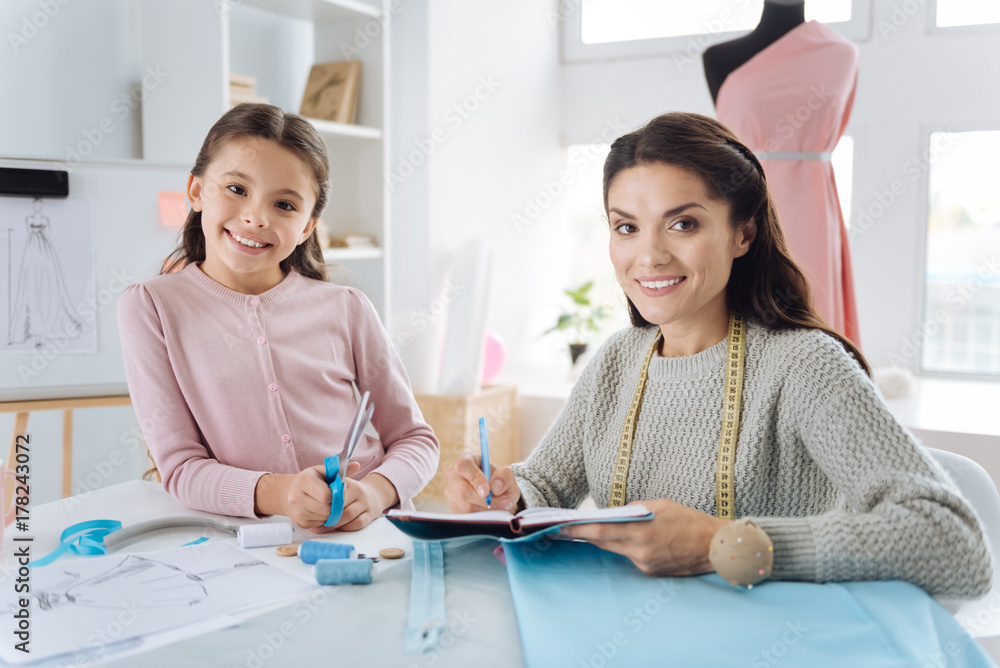 Professional creative designer working with her daughter Professional creative designer working with her daughter