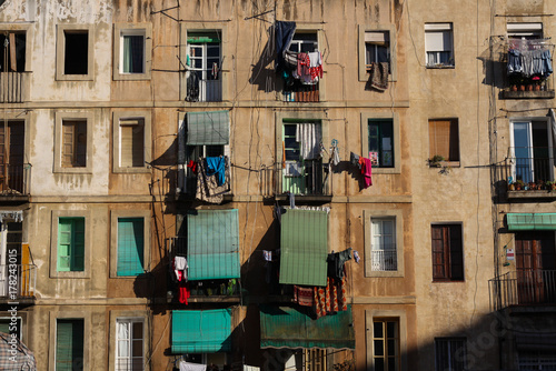 Photography Slum apartments with blinds in Raval, Barcelona, Spain.