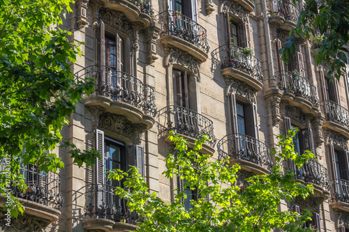 Apartments with wrought iron balconies in Eixample, Barcelona, Spain, illustrating property, luxury and European vernacular architecture photo
