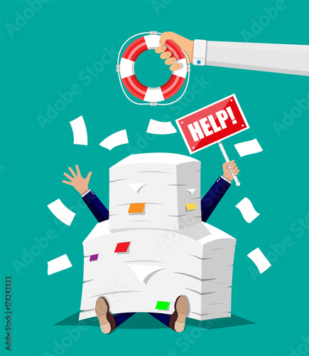 Businessman in pile of office papers