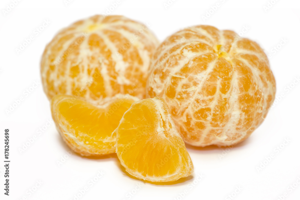 Mandarins (tangerine) isolated on white background.Whole and slices of citrus fruits.The symbol of Christmas holydays. Mandarins (tangerine) isolated on white background.Whole and slices of citrus fruits.The symbol of Christmas holydays.