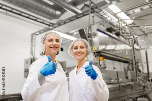 happy women technologists at ice cream factory