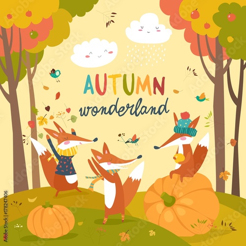 Little foxes playing with leaves in autumn forest