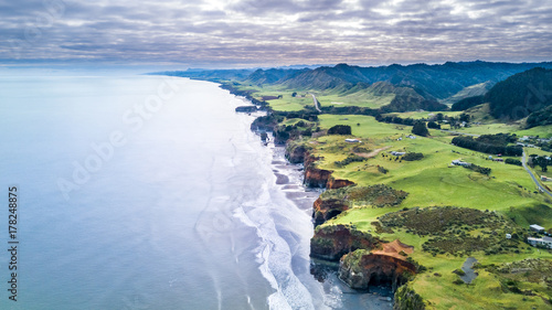 Aerial view on a dramatic Tasman coast line with cliffs and rocks near New Plymouth. Taranaki region, New Zealand.
