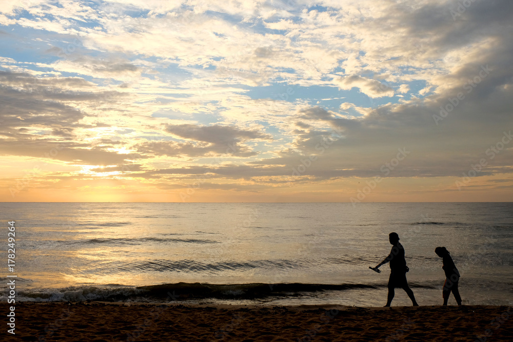 Silhouette of people on the cha-am beach, thailand