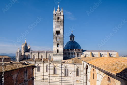 Top view of a cathedral Duomo di Siena against a blue sky. Toskany photo