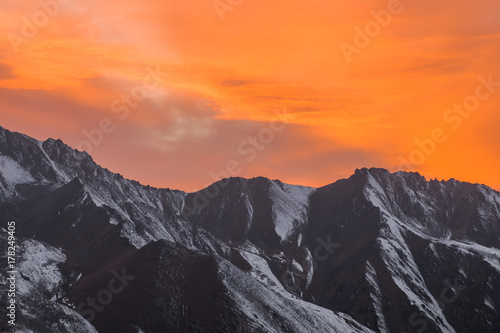 orange sunset over the mountain peaks