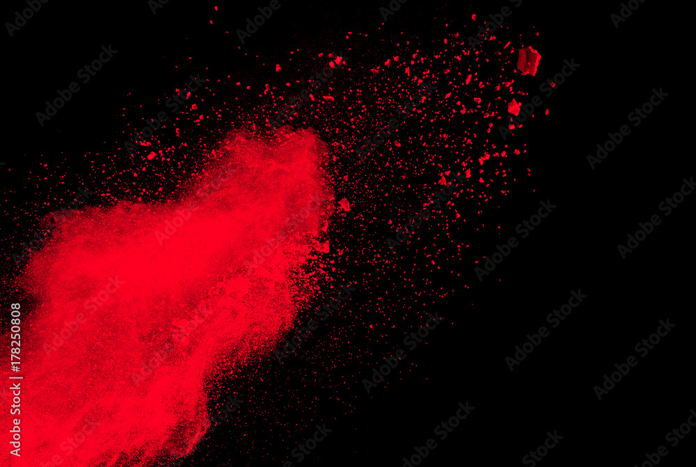 Red Color powder splash cloud isolated on black background